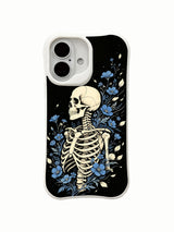 PhoneCasing lifestyle handheld Blue Bloom Night Voyage iPhone 16 Case, female model holding traditional goth side skeleton blue flower artwork outdoors, slim lightweight scratch resistant glossy iPhone 16 cover