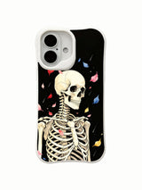 PhoneCasing outdoor urban lifestyle handheld Night Petal Rain iPhone 16 Case, female model holding dreamy goth skeleton falling-petal artwork outdoors, slim lightweight scratch resistant glossy iPhone 16 cove