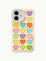 Ditsy Hearts pattern on an iPhone 16 Plus case