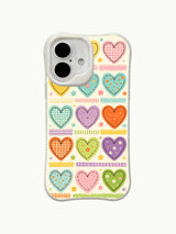 Pastel Scrapbook heart pattern on an iPhone 16 Plus case