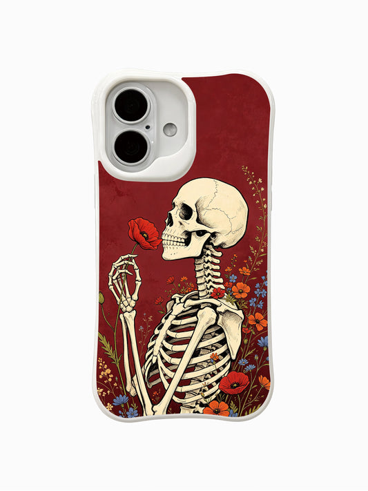 PhoneCasing Poppy Whisper fine art iPhone 16 Case, vintage old-school goth tattoo artwork by Morrigan Vale featuring skeleton smelling single red poppy surrounded by mixed wildflowers on burgundy textured background