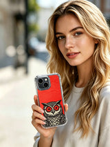 Person holding a red-lens owl case near their face