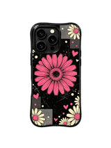 PhoneCasing iPhone 16 pro Case with scattered delicate cream small daisies framing the central raspberry spotlight flower, paired with soft heart speckle accents, Ruby Daze vintage collage illustration, tough premium phone casing.