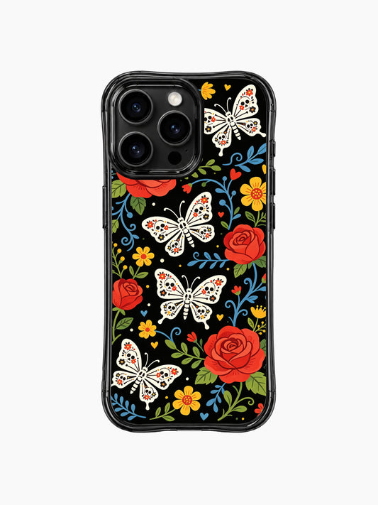 PhoneCasing iPhone 16 pro max Case featuring Estrella Nocturna art: vibrant red roses and whimsical sugar skull butterflies with floral details, set against a black background with blue vines and yellow flowers, folk art design for everyday use on iPhone 16 pro max casing.