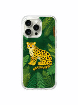 Quiet Fierceness: A large seated cat with a curling tail against closely packed green foliage.