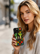 Skeleton Band With Sombreros Desert Garden artwork on an iPhone 16 Pro Max case