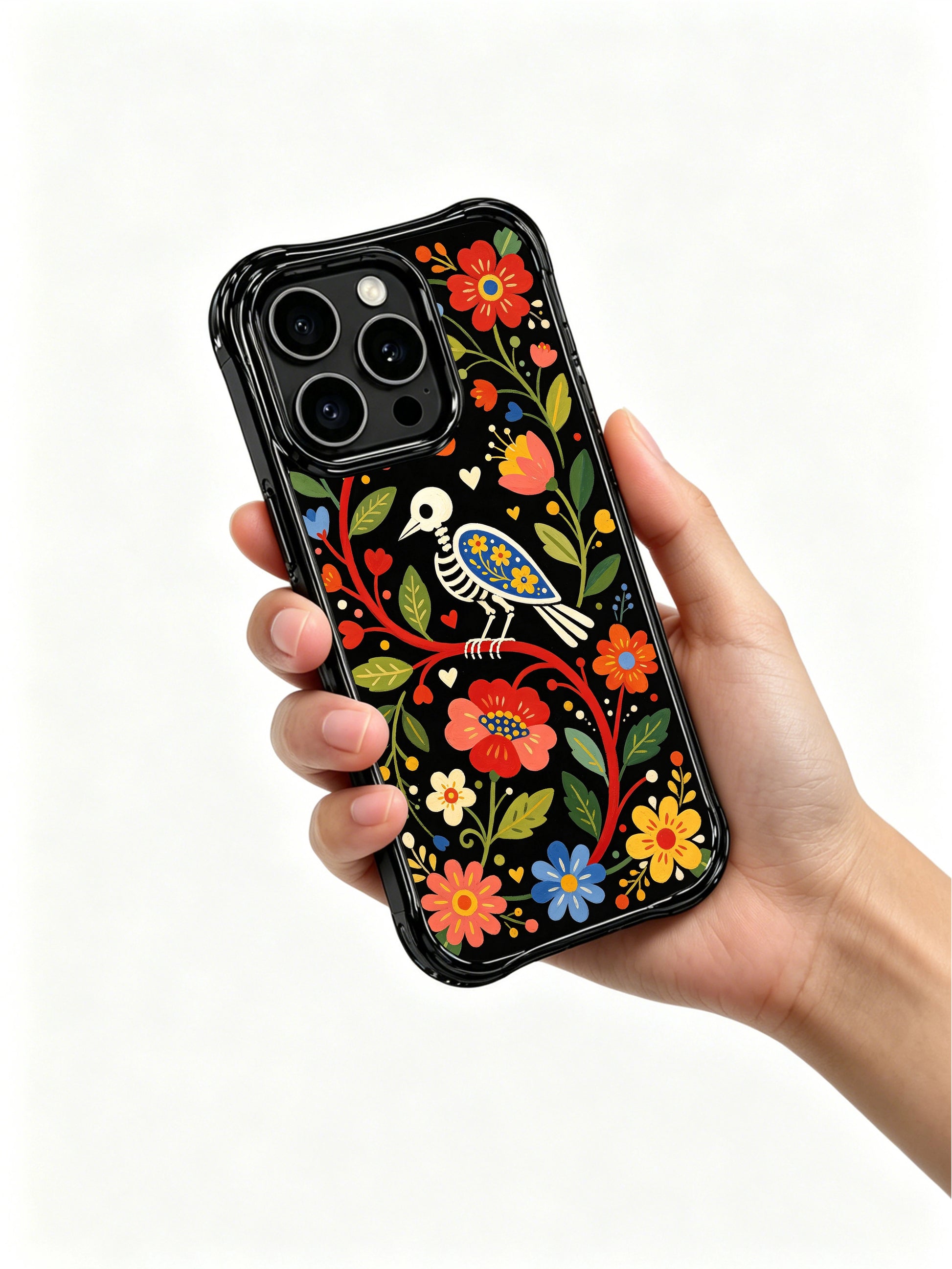 PhoneCasing iPhone 16 pro max Case featuring a skeleton bird centered within a symmetrical folk floral border of red, blue and yellow blooms, balanced folk art design for iPhone 16 pro max casing.