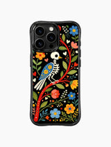 PhoneCasing iPhone 16 pro max Case with a skeleton bird sitting within a wreath of vibrant folk flowers, hearts and leaves, creating a festive Day of the Dead look on black iPhone 16 pro max casing.