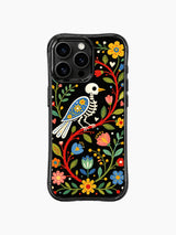 PhoneCasing iPhone 16 pro max Case featuring a skeleton bird surrounded by lush green leaves and a variety of colorful folk flowers, creating a lively and romantic folk art pattern on iPhone 16 pro max casing.
