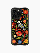 PhoneCasing iPhone 16 pro max Case with a skeleton bird surrounded by small heart shapes and colorful folk flowers, set against a black background with green leaves, whimsical folk print on black iPhone 16 pro max casing.
