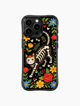 PhoneCasing iPhone 16 pro max Case with a floral skeleton cat wearing a flower crown in midnight bloom garden, surrounded by colorful folk flowers and hearts, gothic botanical print on iPhone 16 pro max casing.