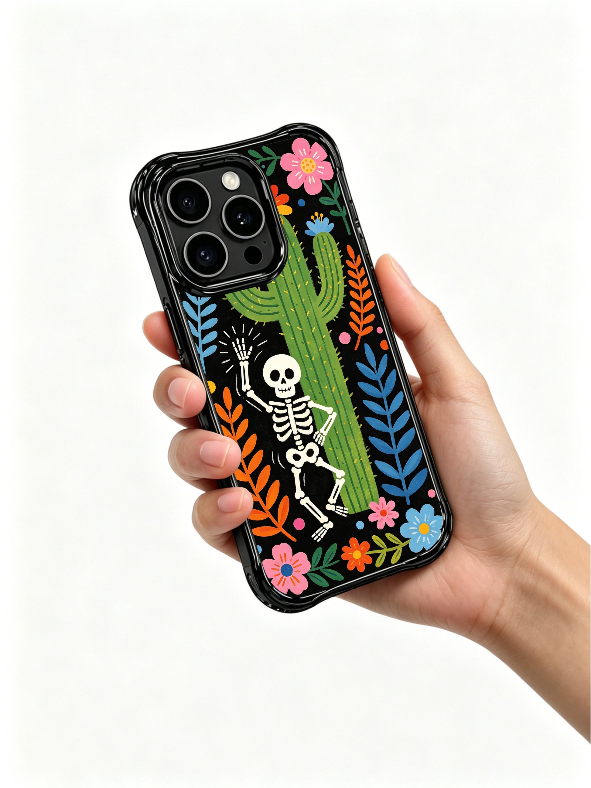 PhoneCasing iPhone 16 pro max Case featuring a full-body dancing skeleton surrounded by a lush border of desert flowers and tropical leaves, Día de los Muertos folk art, premium anti-drop iPhone 16 pro max casing.