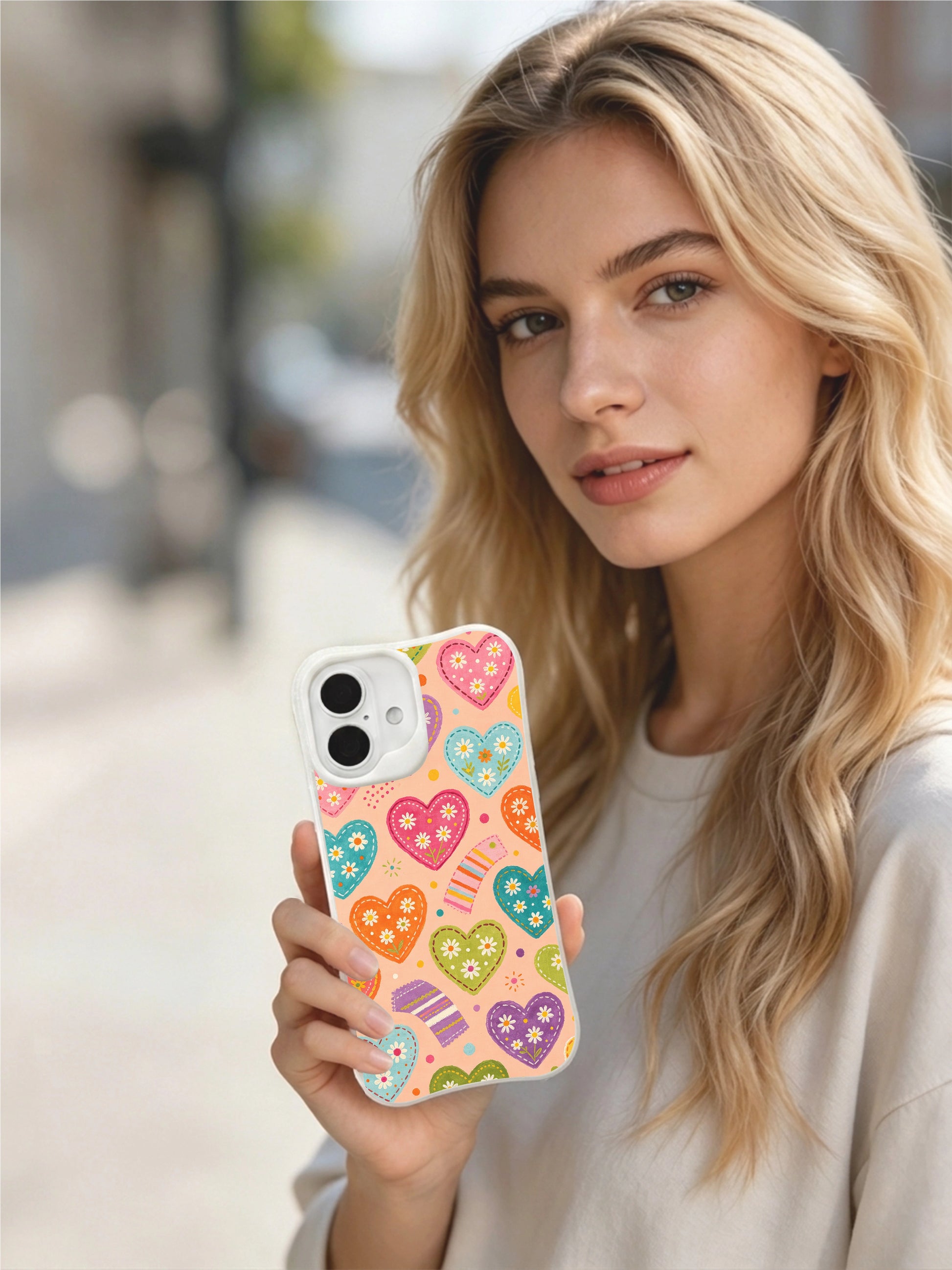 PhoneCasing soft peach heart daisies iPhone 16 plus case, gentle pastel heart pattern with tiny daisy blooms, fade-proof printing.