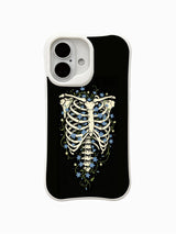 PhoneCasing Star Blossom In Bone fine art iPhone 16 Case, original Morrigan Vale traditional old-school goth tattoo artwork with ribcage skeleton wrapped in glowing tiny blue star flowers on distressed solid black backdrop, scratch resistant glossy casing crafted in California