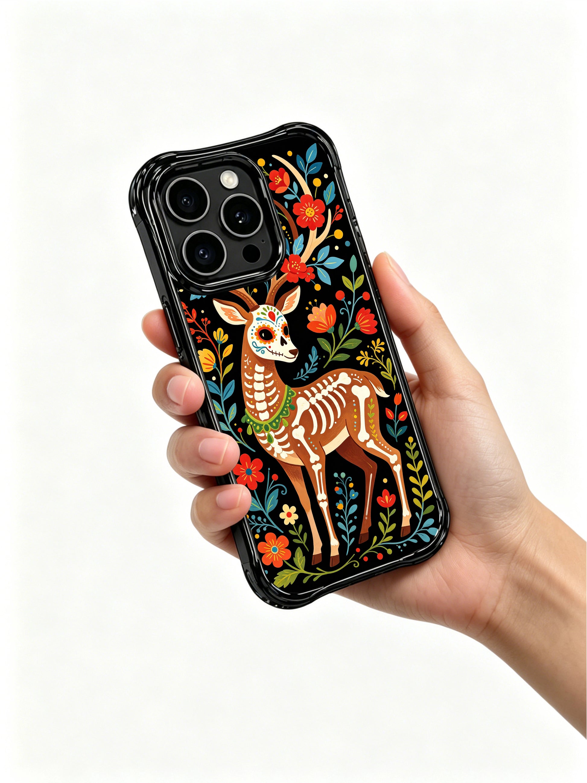 PhoneCasing iPhone 16 pro max Case featuring a close-up view of a sugar skull deer with detailed floral skull markings on its face, surrounded by flowers and leaves, whimsical Day of the Dead design on iPhone 16 pro max casing.