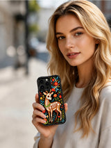 PhoneCasing iPhone 16 pro max Case with a sugar skull deer framed by a full border of red, yellow and blue flowers, creating a vibrant folk art garden scene on iPhone 16 pro max casing.