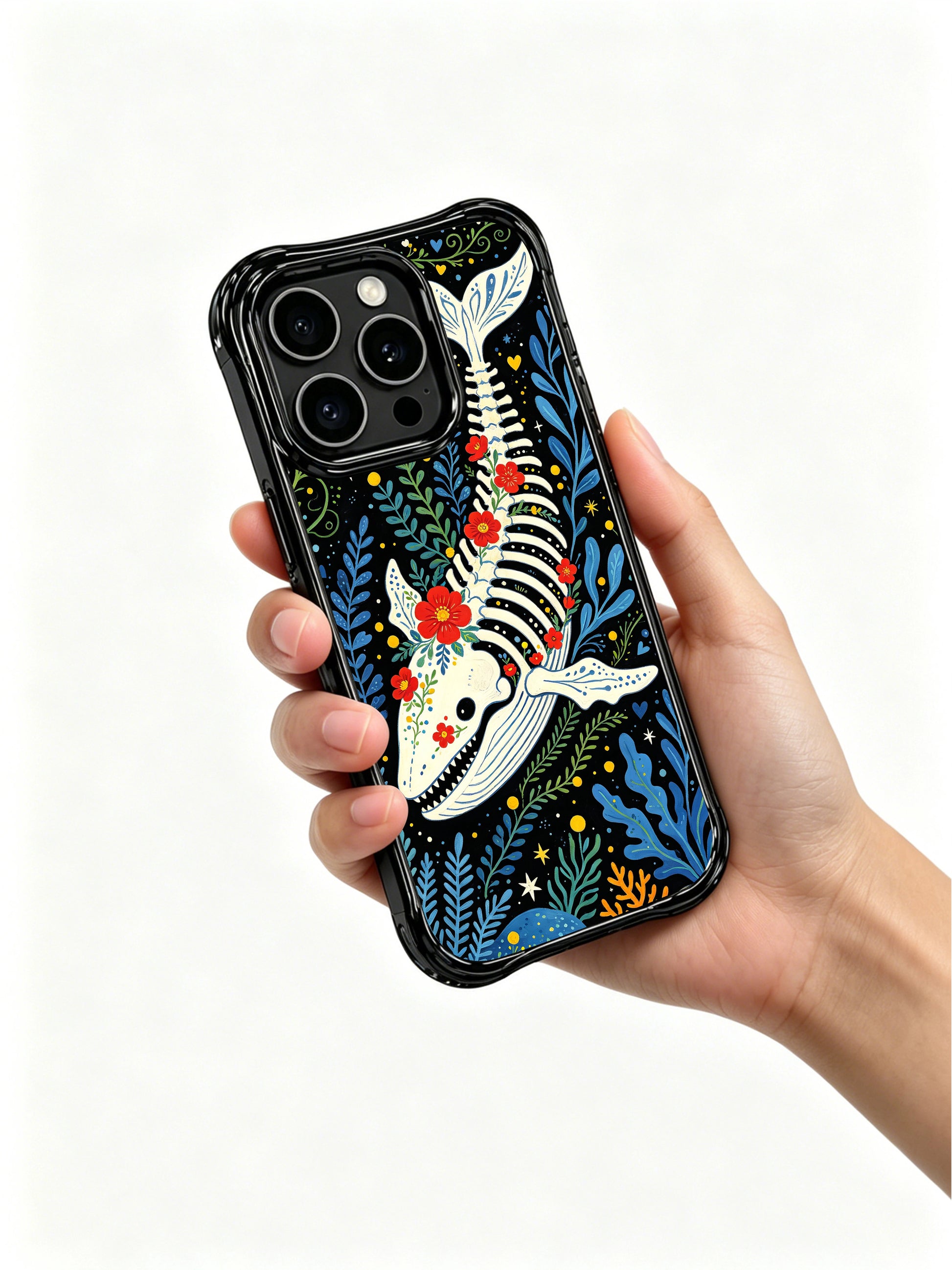 PhoneCasing iPhone 16 pro max MagSafe case featuring a sugar skull whale design. Vibrant ocean folk art style with red roses and blue seaweed.