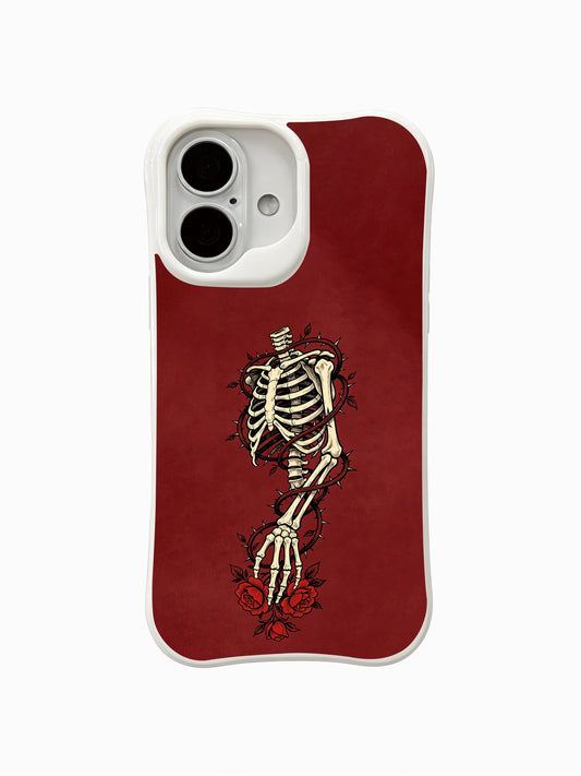 PhoneCasing Thorn Rose Path fine art iPhone 16 Case, original Morrigan Vale traditional old-school goth tattoo artwork with thorny vines wrapping skeletal hand & deep red roses on aged burgundy backdrop, scratch resistant glossy casing crafted in California