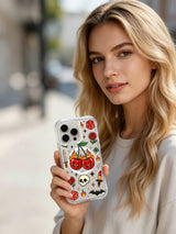 PhoneCasing iPhone 15 pro Case with top placed red rose, bottom hollow skull detail, single dotted dice and mischievous flaming cherry artwork, premium glossy finish art iPhone 15 pro casing.