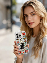 Black cat beneath crescent eye with butterflies and roses artwork on an iPhone 15 Pro case