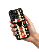PhoneCasing iPhone 16 pro Case with textured aged scratch grunge matte canvas layered alternating vertical/horizontal red-black-cream checker block segments and triple variant solid/striped heart shapes with border vintage cream daisies, Ruby Daze Punk Daisy Checker Love artist-designed wavy casing for sharp confident dark punk feminine style.