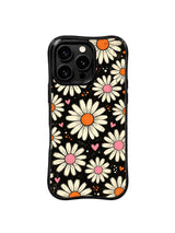 PhoneCasing iPhone 16 pro Case with full-bleed textured grain black backdrop freely scattered cream daisy pink heart orange dot layout full of gentle quiet everyday joy retro charm, Ruby Daze signature collection, MagSafe compatible wavy black protective art casing.