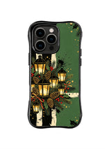 Pinecone Lantern Cluster pattern on a black iPhone 14 Pro case with glowing vintage lanterns, pinecones, red berries, fir sprigs and a forest-green field