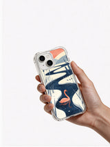 Hand holding an iPhone 13 case featuring the Pink Swan Lake artwork