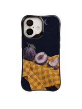 Midnight Quarter plum slices and crescent artwork on a black iPhone case
