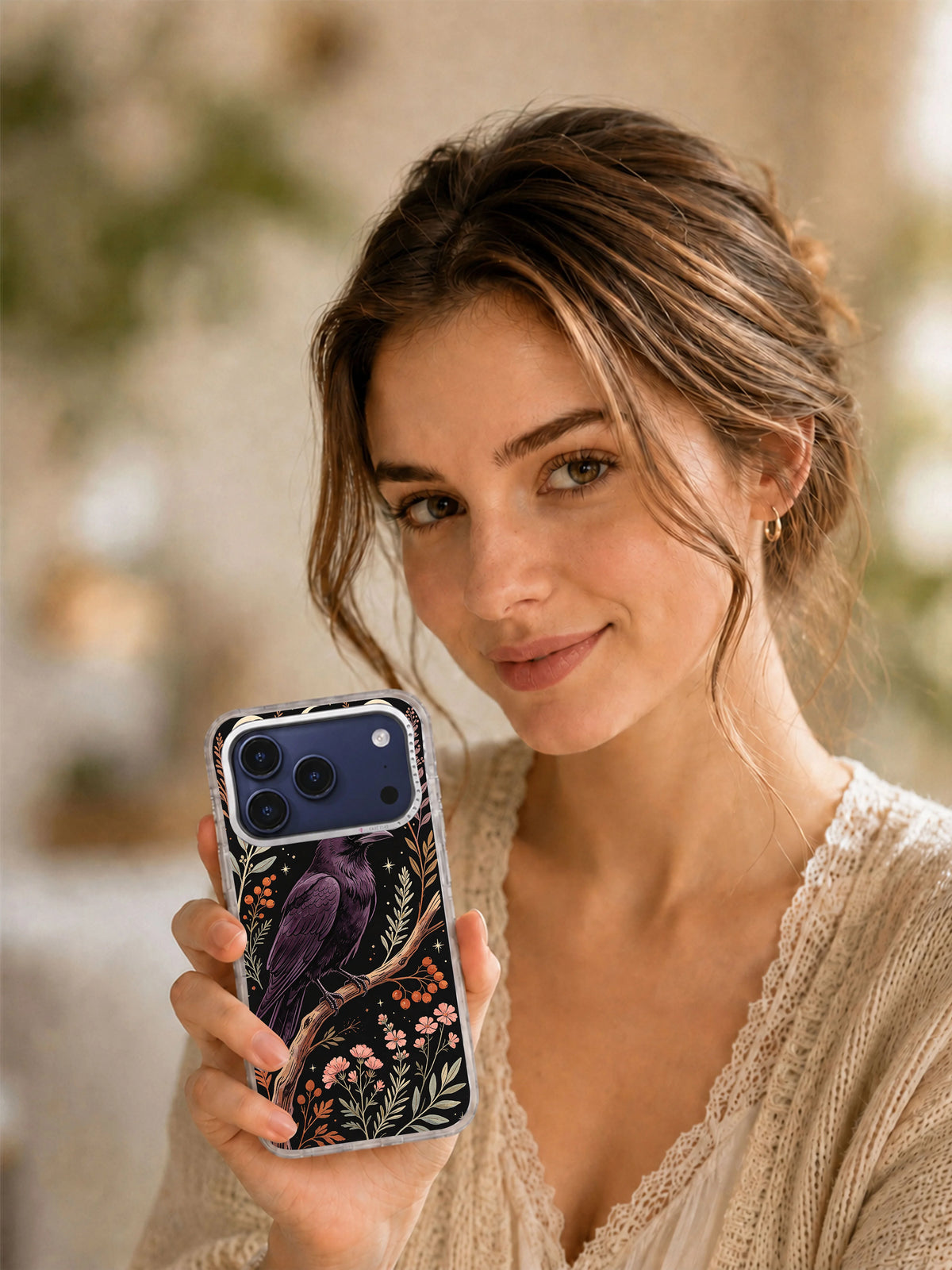 Lifestyle view of Plum Raven Herbarium iPhone case with celestial botanical art
