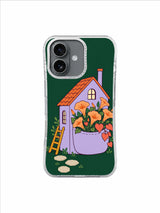 Lavender house with an apricot flower pocket garden on deep pine green