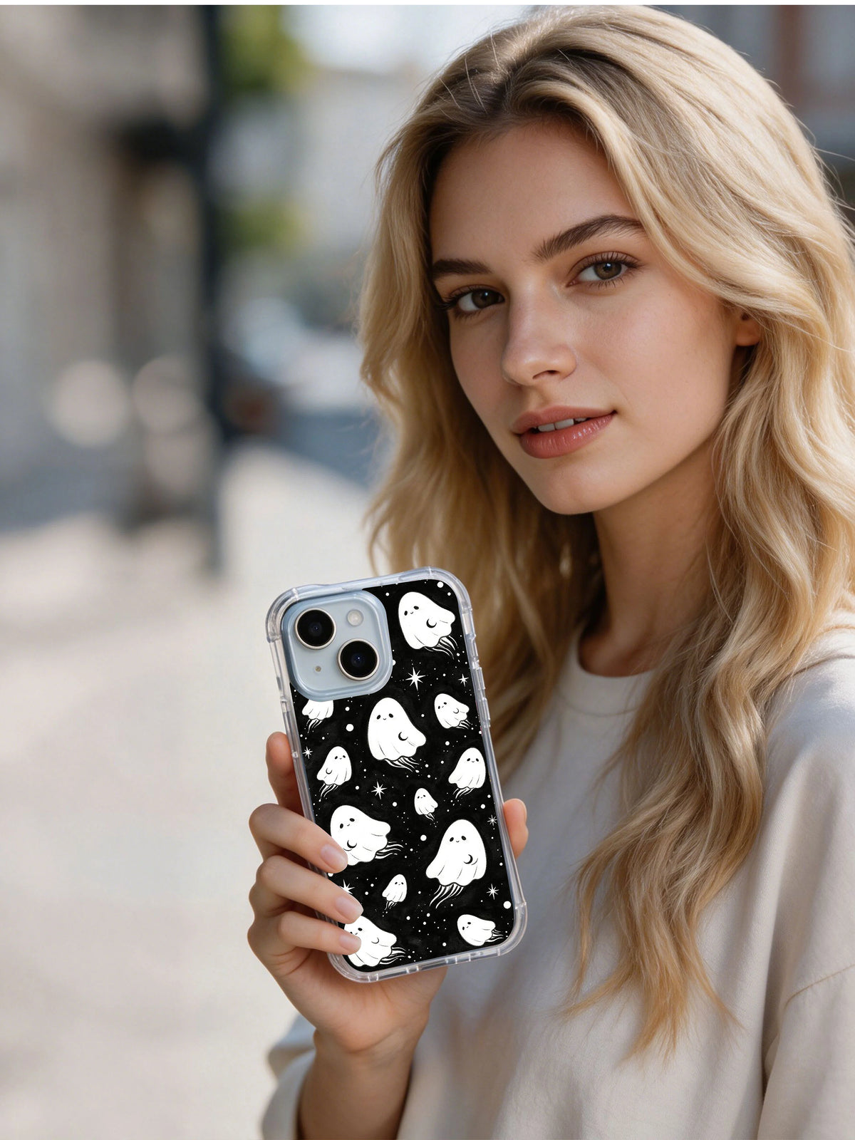 Person holding The Pocket Moon Watchers celestial iPhone 15 Plus case