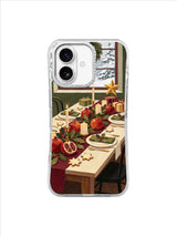 Golden paper star beside a pomegranate Christmas table and snowy window on an iPhone 17 case