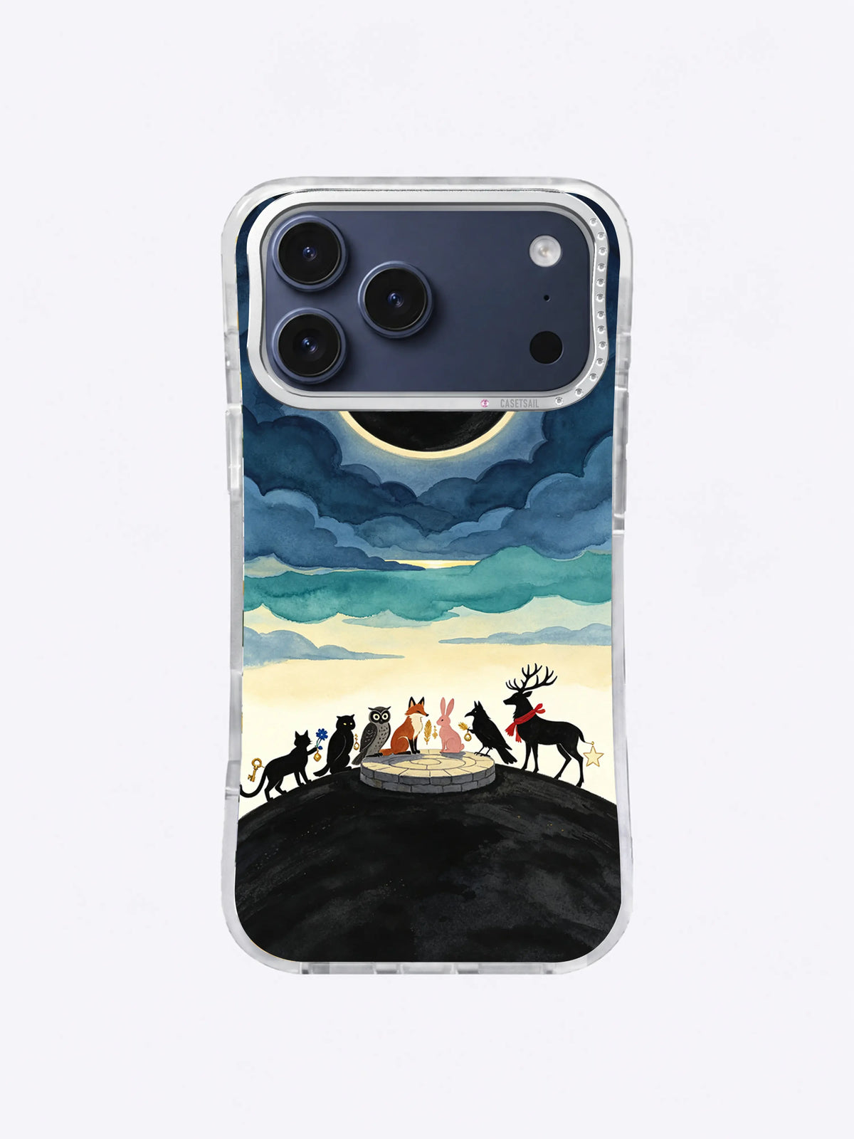 Pale gold ring surrounding a black eclipse above animal silhouettes on an iPhone case