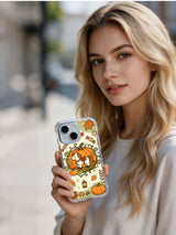 Woman holding the Pumpkin Patch Pony Friends iPhone 14 case