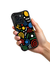 Colorful geometric doodle iPhone 15 Pro case held in hand