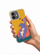 Hand holding Rabbit Takes a Long Pause artwork on a black iPhone case