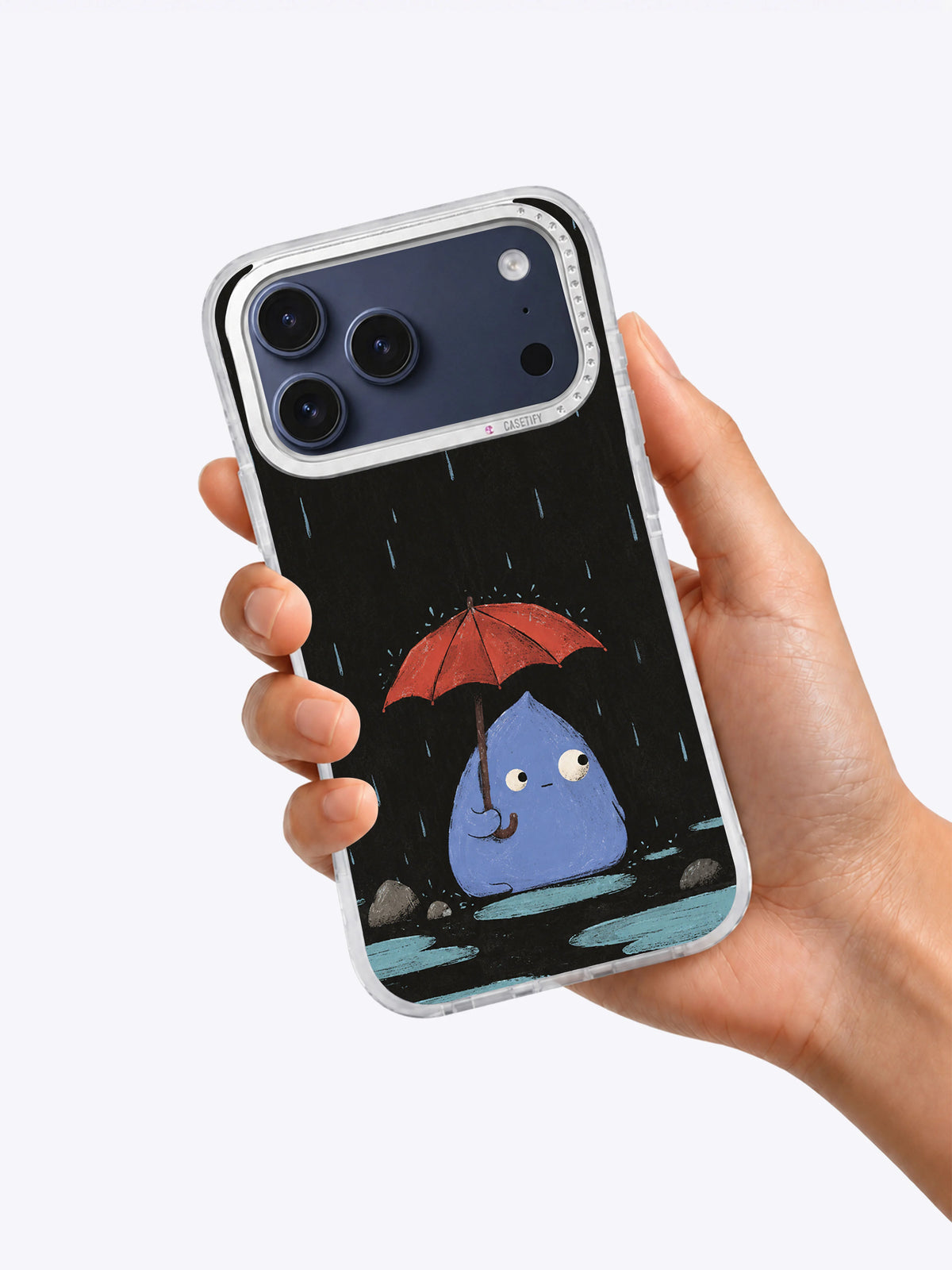Hand holding The Little Keeper of Rain phone case