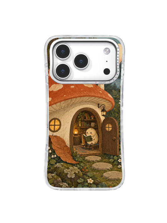 Cream beetle reading at the doorway of a terracotta mushroom house on an iPhone 17 Pro case