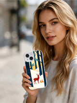 The Red Forest Gathering iPhone 13 case shown in a lifestyle portrait