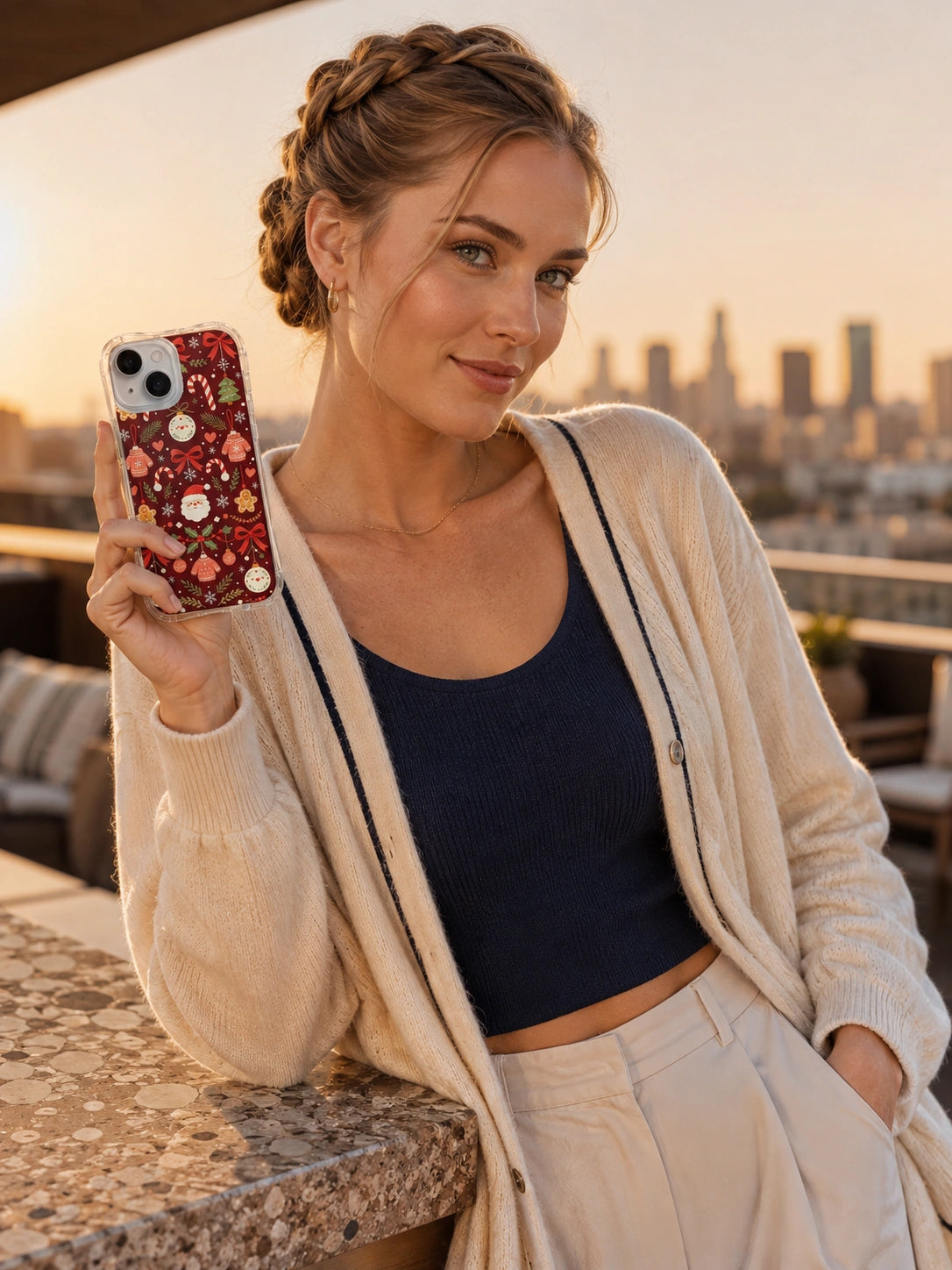 Adult woman on a rooftop holding the Red Ribbon Christmas Charm iPhone 14 Plus case with Ribbon Ornament Carol artwork