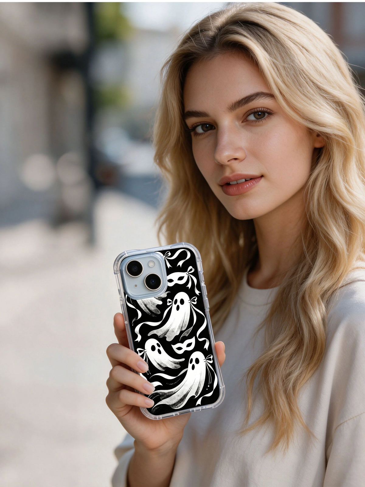 Person holding black and white Ribbon Ghost Waltz iPhone 15 Plus case
