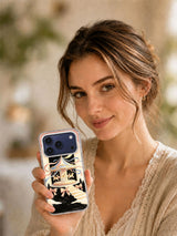 Ribbon Moon Carousel iPhone 17 Pro Max case in a warm outdoor lifestyle scene