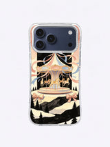 Snow Terrace Moon Carousel artwork on an iPhone 17 Pro Max case with cream ribbons and dark mountain silhouettes