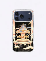Starlit Mountain Carousel artwork on an iPhone 17 Pro Max case with an antique gold canopy and black evergreens