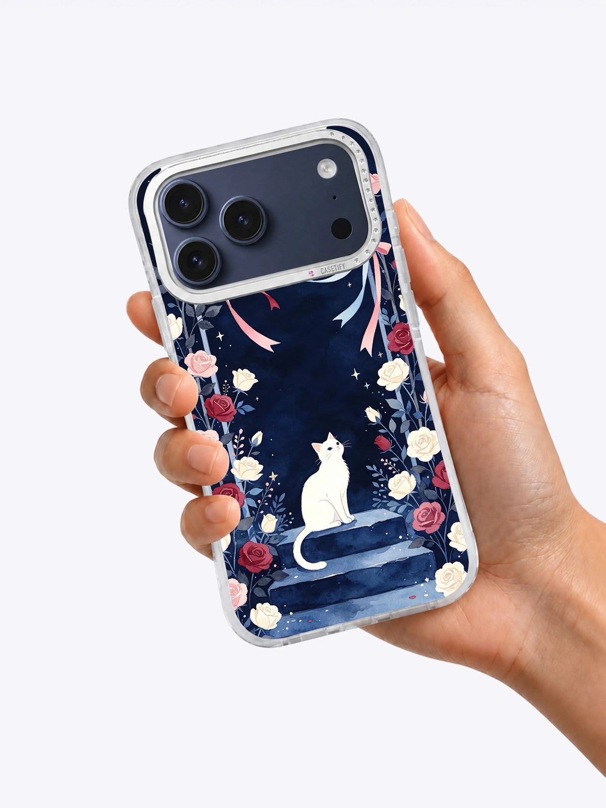 Hand holding The Ribbon Moon Garden iPhone case