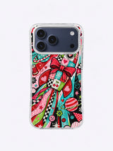 Candy Orbit Workshop artwork on an iPhone case with a pale patchwork rocket, red bow, striped planet, gears, stars, and candy-colored ribbon trails
