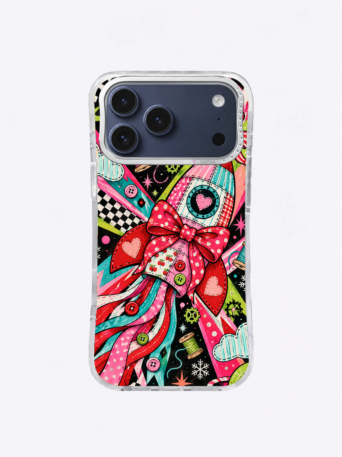 Polka-Dot Heart Rocket artwork on an iPhone case with a red bow, heart details, dotted pink panels, ribbon exhaust, orbit circles, and snow crystals