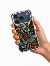 Sage Moon Herbarium iPhone case held in hand showing sage, rust, and plum botanical artwork