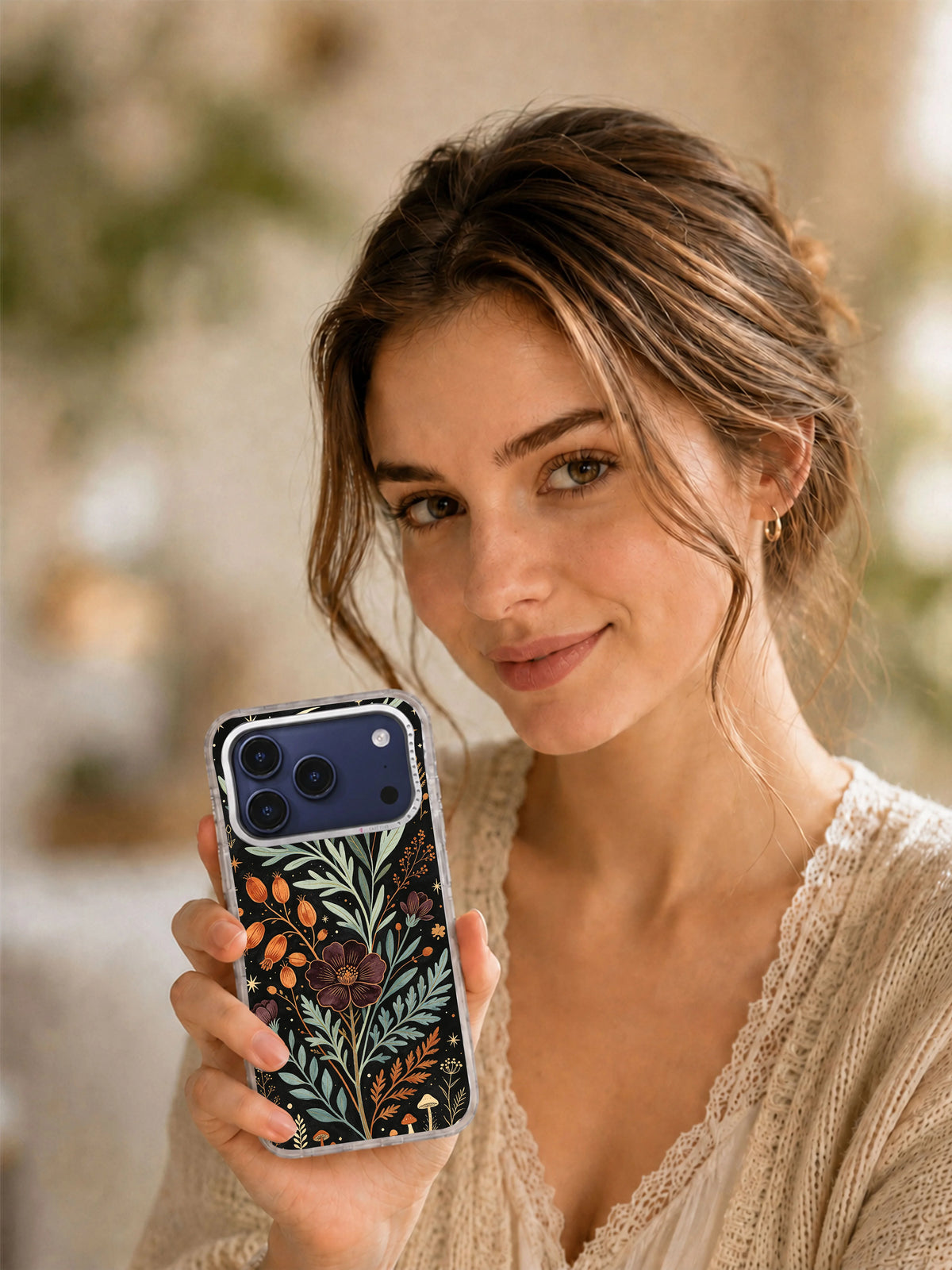 Lifestyle view of Sage Moon Herbarium iPhone case with dark herbarium and crescent artwork